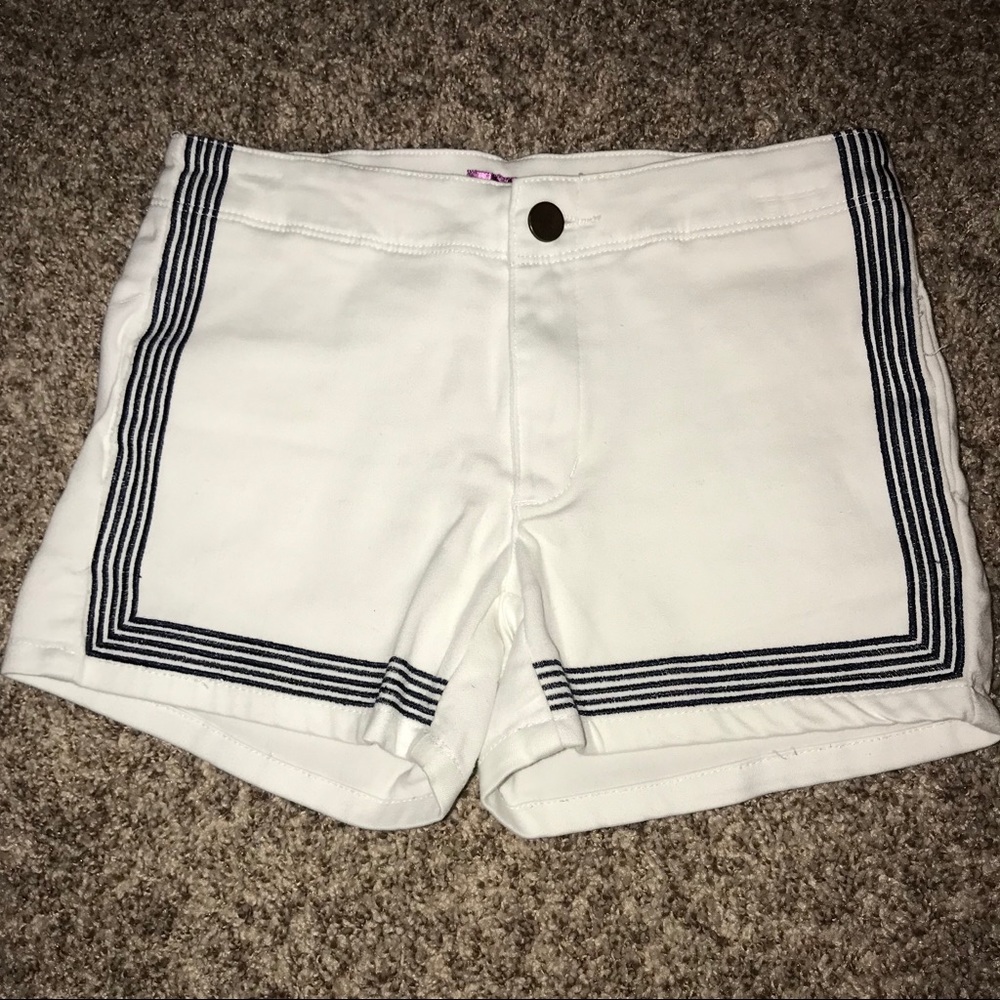 white shorts with navy detail